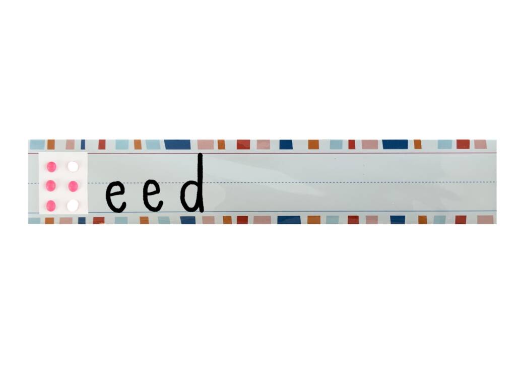 Reed with the "R" in braille using candy dots.