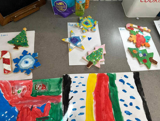 Multiple salt dough shapes that are Christmas and winter themed and painted