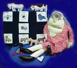 Story Board for Puppet of old lady with picture cards and objects of animals.