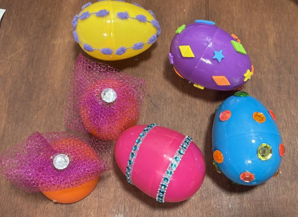 Several plastic eggs textured on a table top