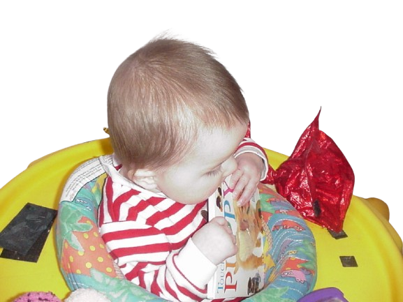 Austin as a baby playing in his exersaucer.