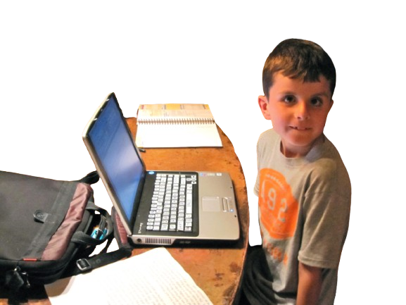 Austin with his laptop and braille note.