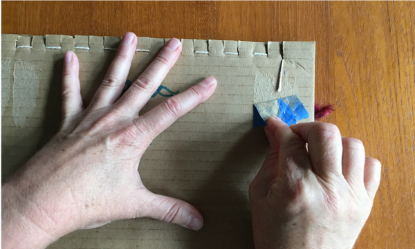 Removing tape from the back of the loom Removing tape from the back of the loom