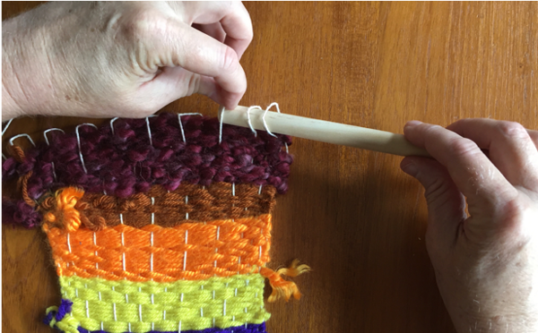 Inserting dowel through loops Inserting dowel through loops