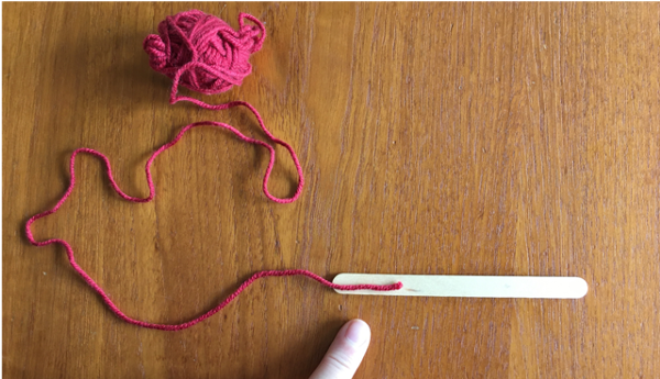 Attaching yarn to popsicle stick Attaching yarn to popsicle stick