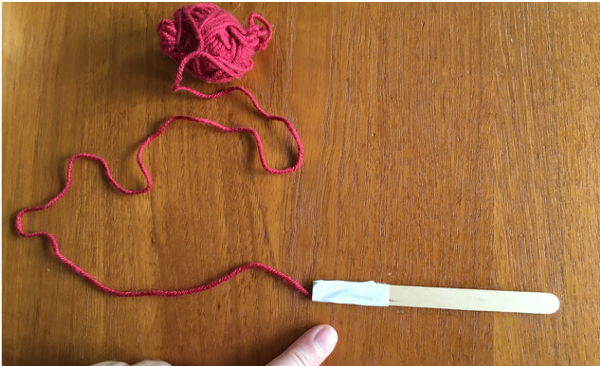 Taped end of popsicle stick Taped end of popsicle stick