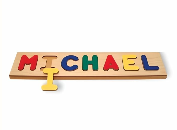 Wooden puzzle with individual letters spelling MICHAEL.