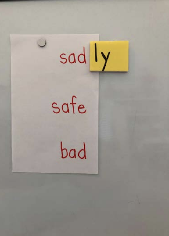 reading words are written in red and the “ly” ending is on a yellow background.